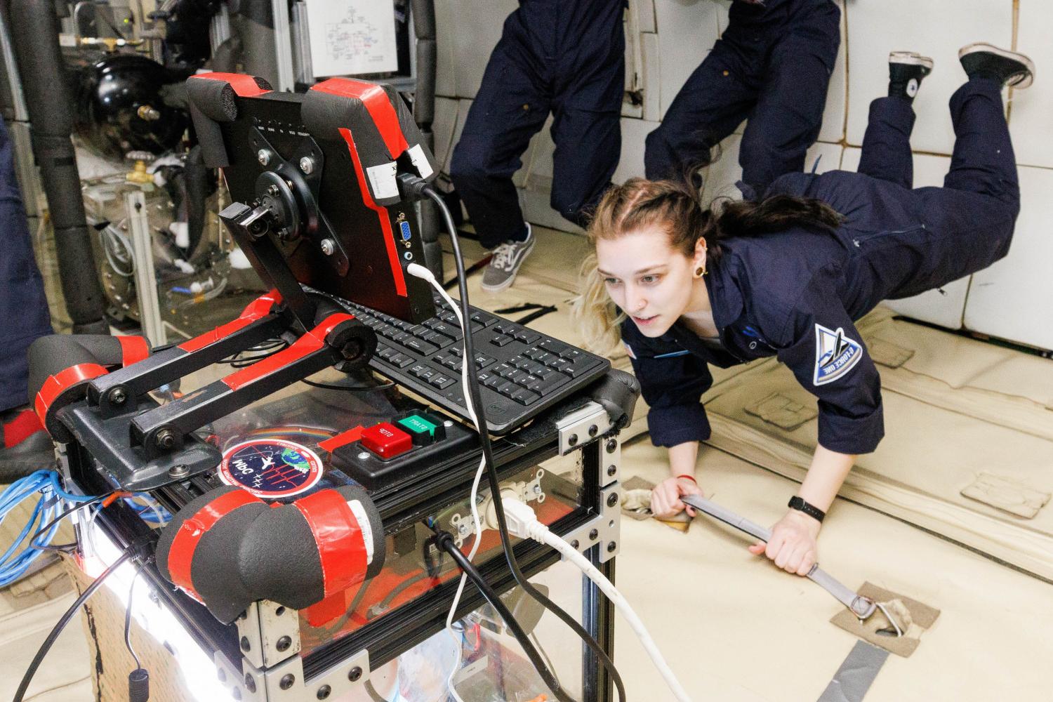 Carthage space science students testing their PROTO payload experiment on a zero-g flight.